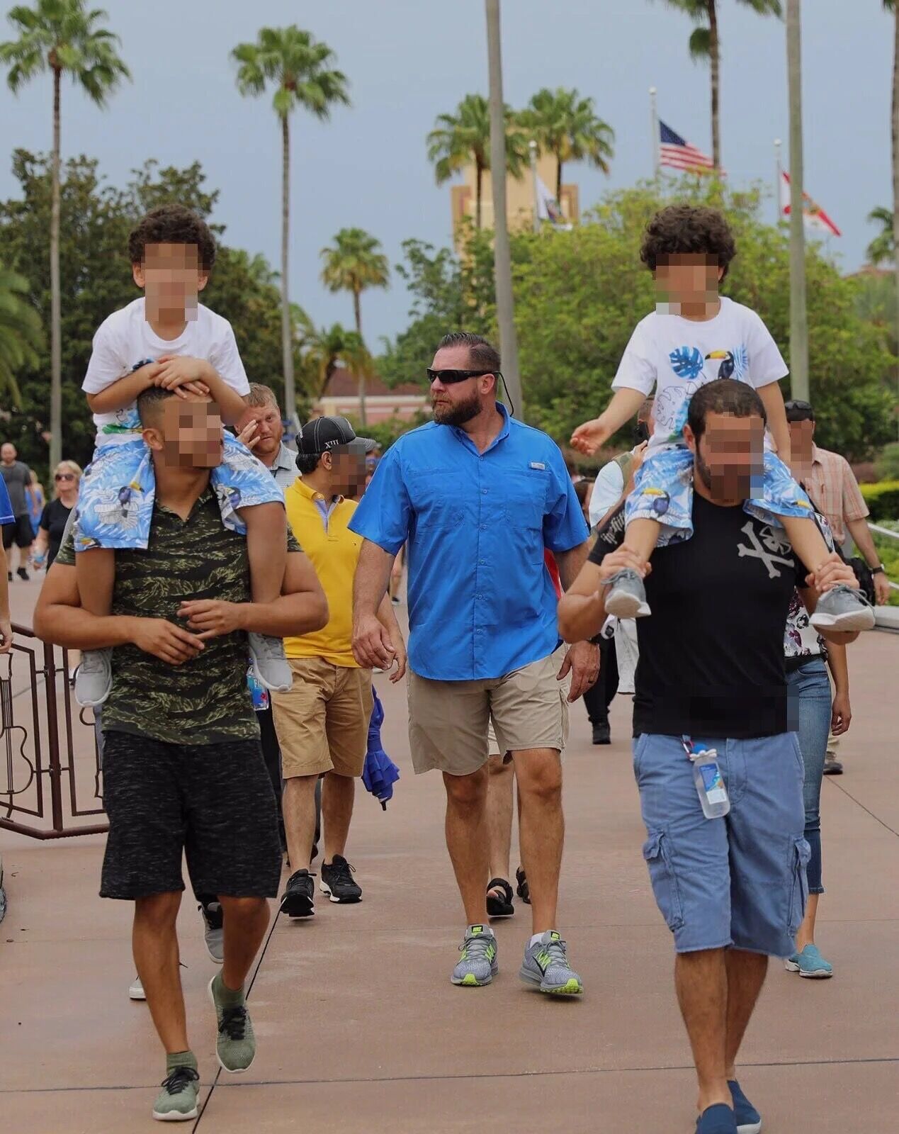 Jan-Lee protection agent in casual summer clothes walking with a family on vacation